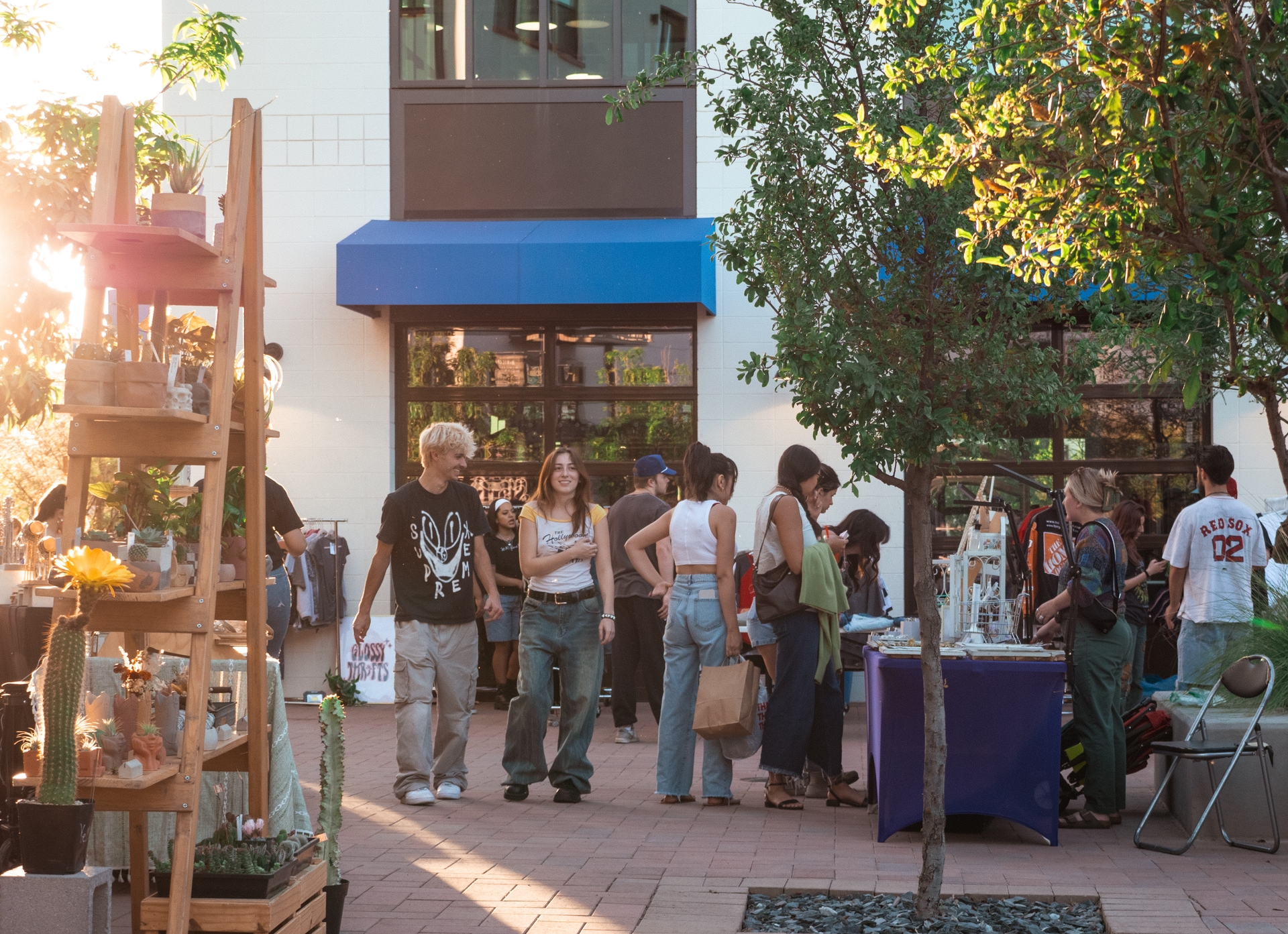 People gathering at outdoor popup event